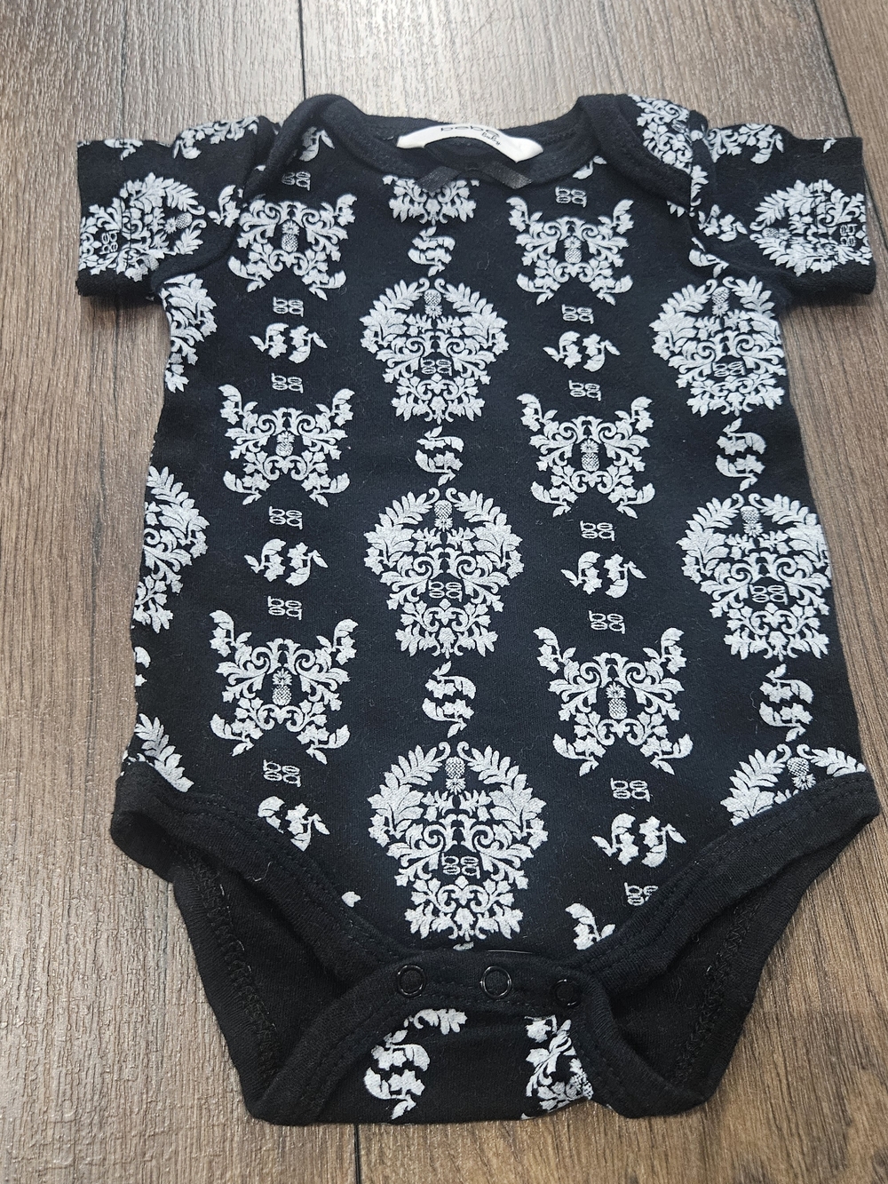 bebe Black One-Piece Bodysuit with White Damask Print